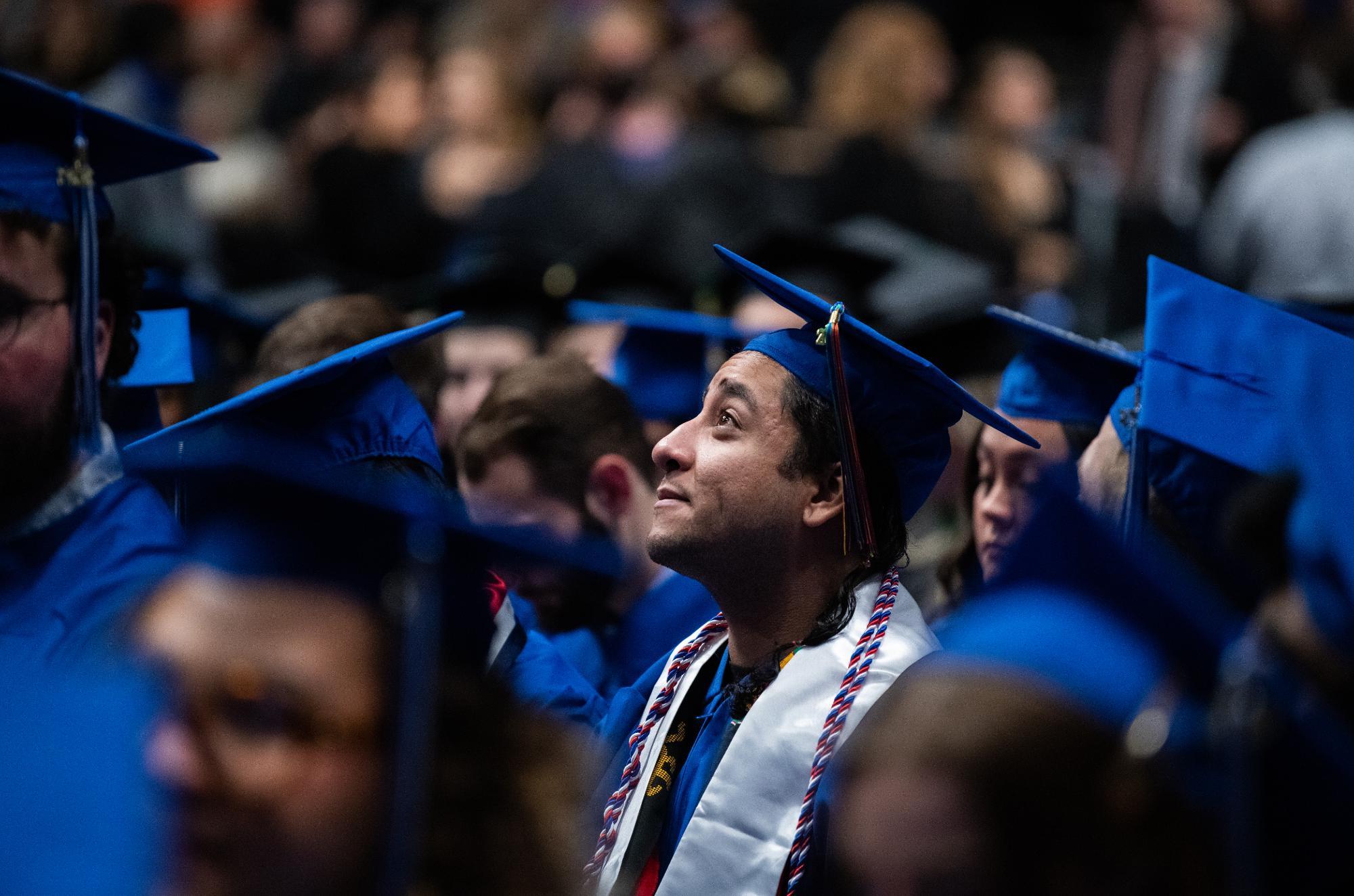 Graduate smiling at Commencement.